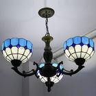 Blaue Schmiedeeisen-Lampen-Tiffany-Art-Leuchter, die Licht hängen